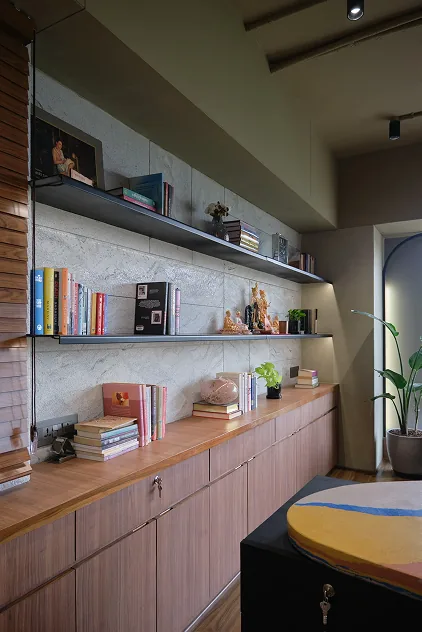 Floating shelves styled with books and idols