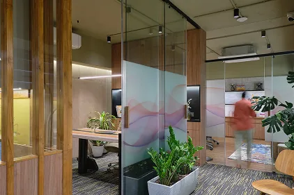Glass partition with graphic film between cabins