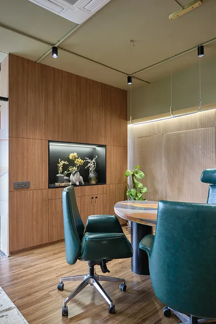 Meeting room display nook with vases and sculptural rabbit