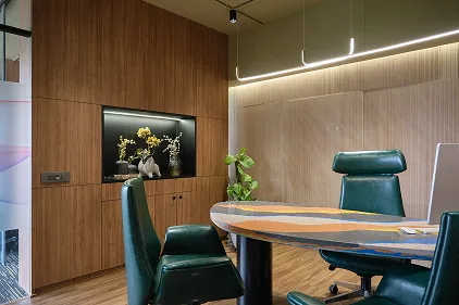 Meeting room with terrazzo table and walnut cabinetry