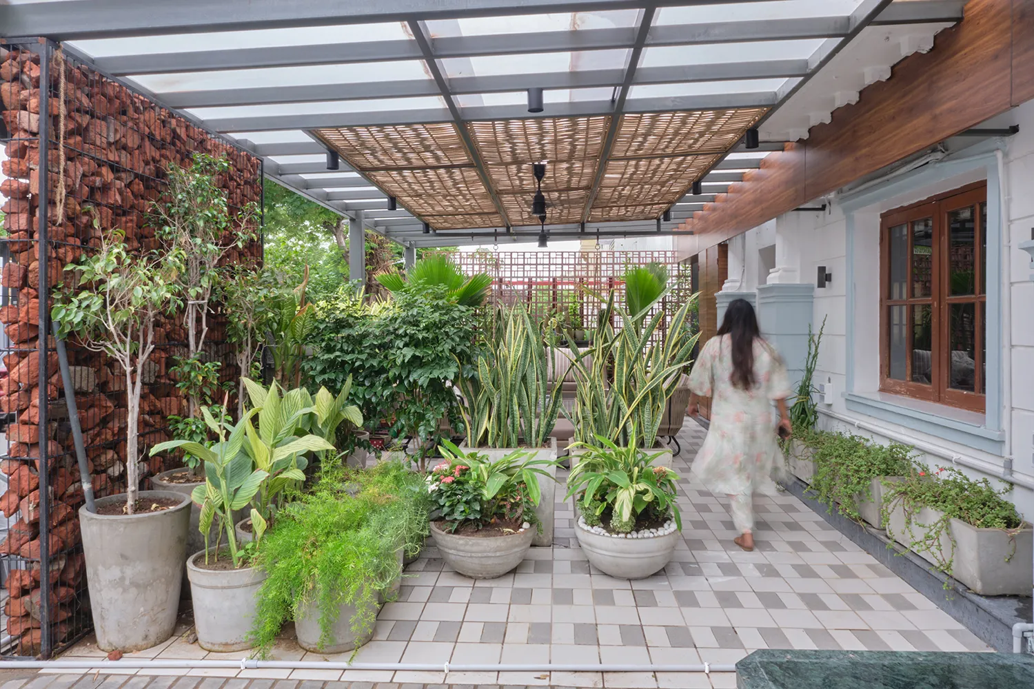 Kaveri Residence — bespoke outdoor living with pergola walkway and natural materiality