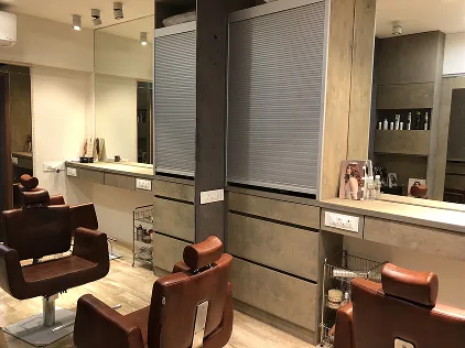 Styling stations with mirrored storage cabinetry