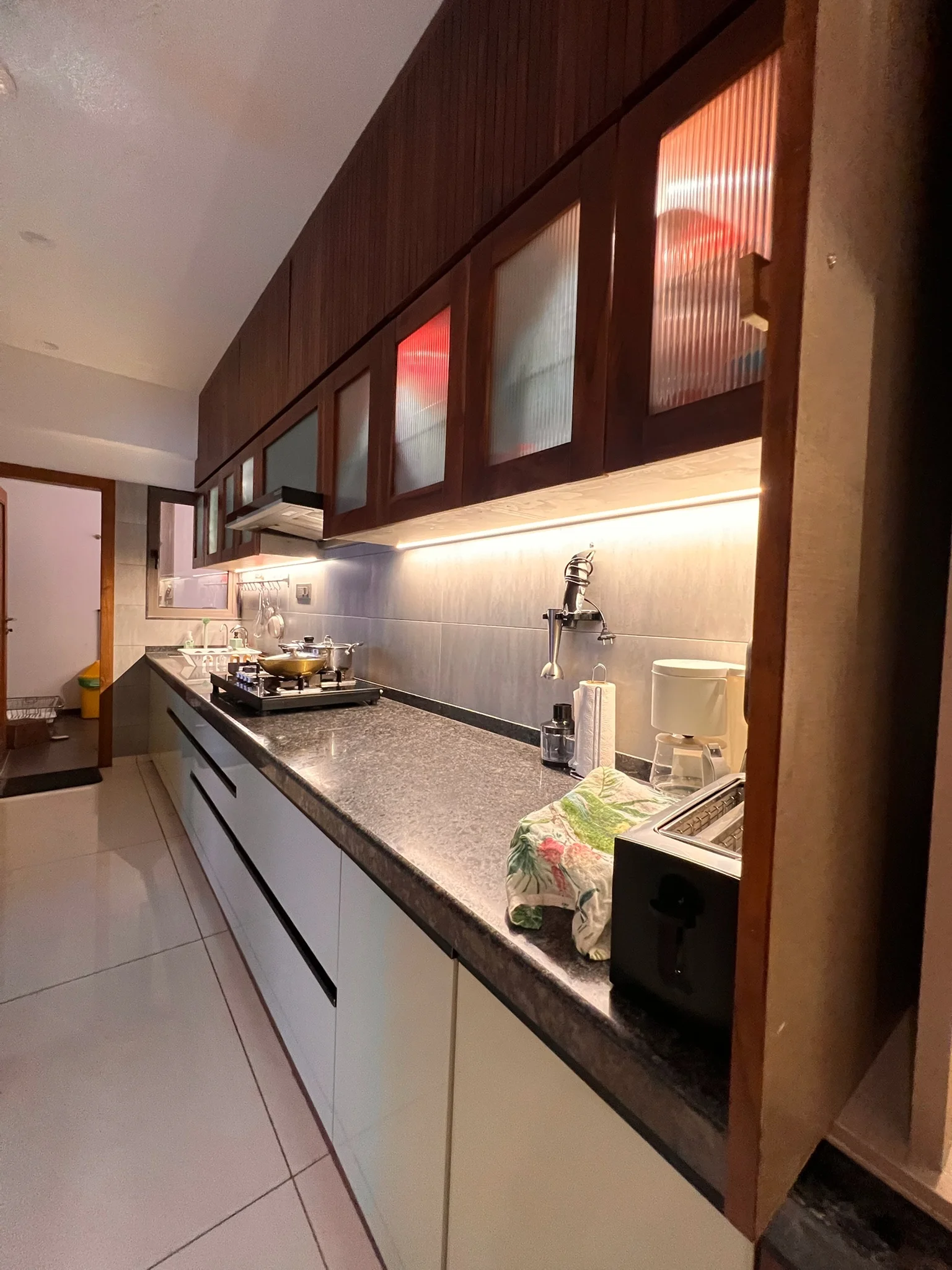 Galley kitchen with frosted glass cabinets