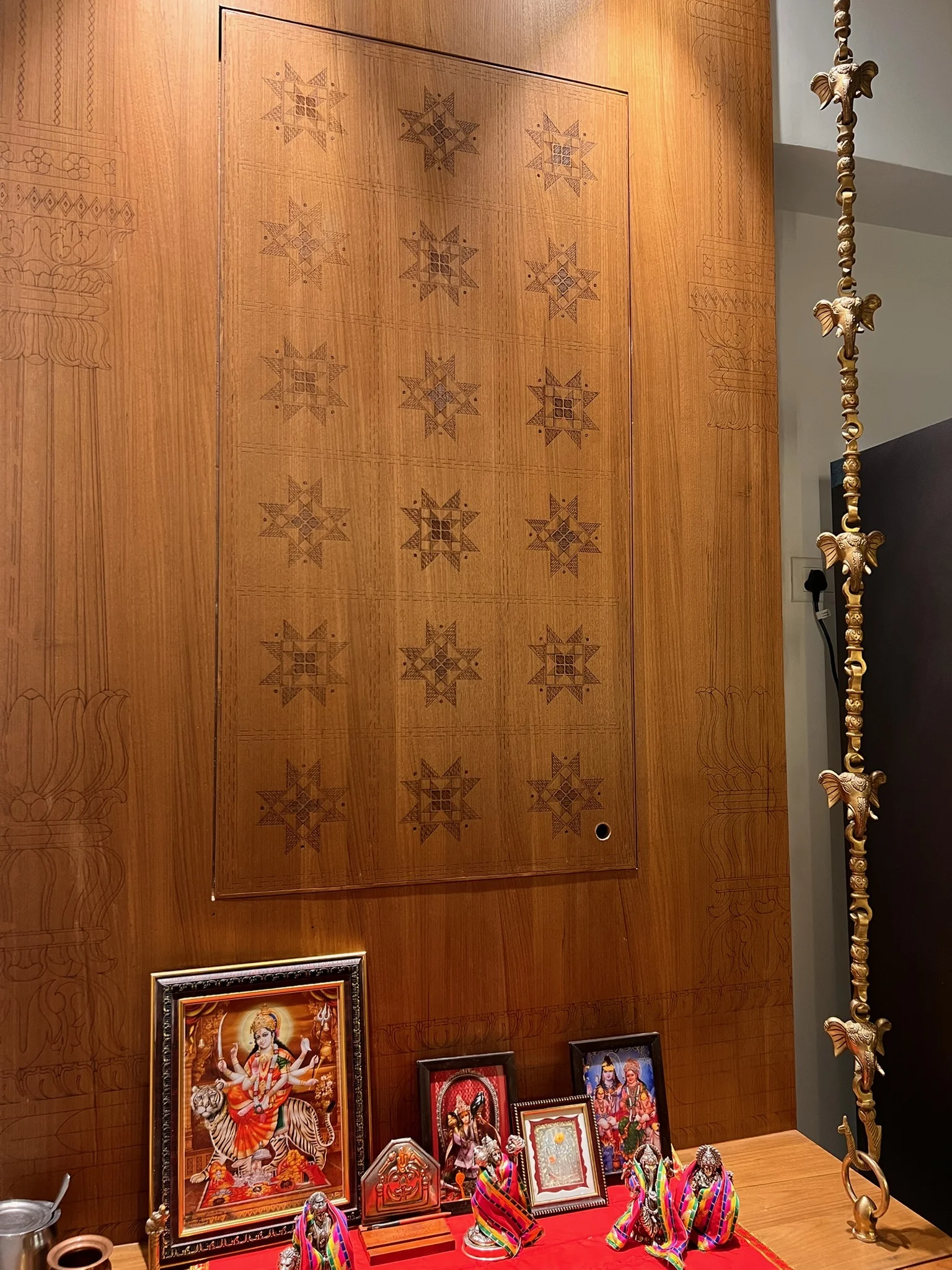 Pooja room wooden temple with star carved doors