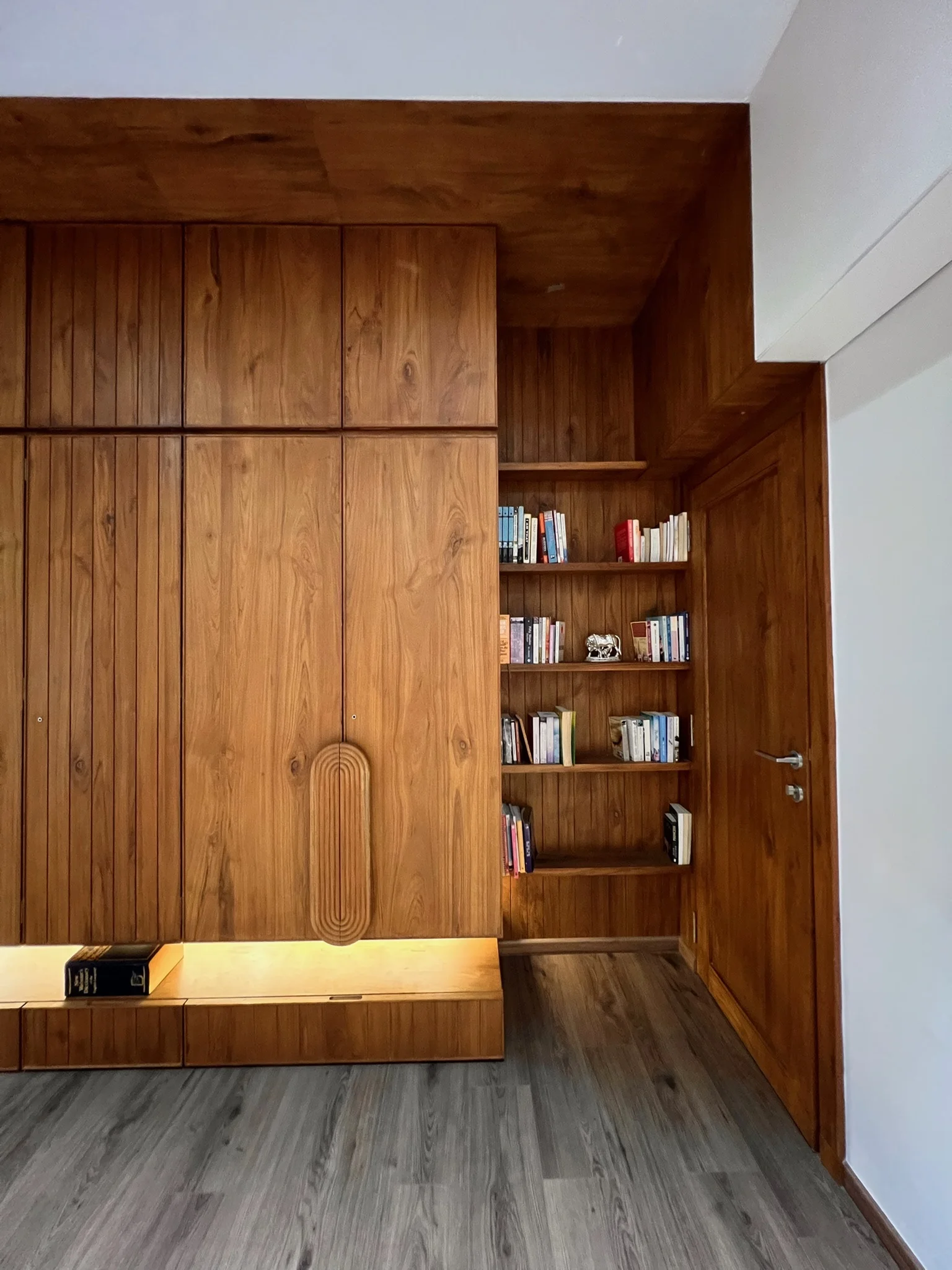 Wooden wardrobe with built-in bookshelf
